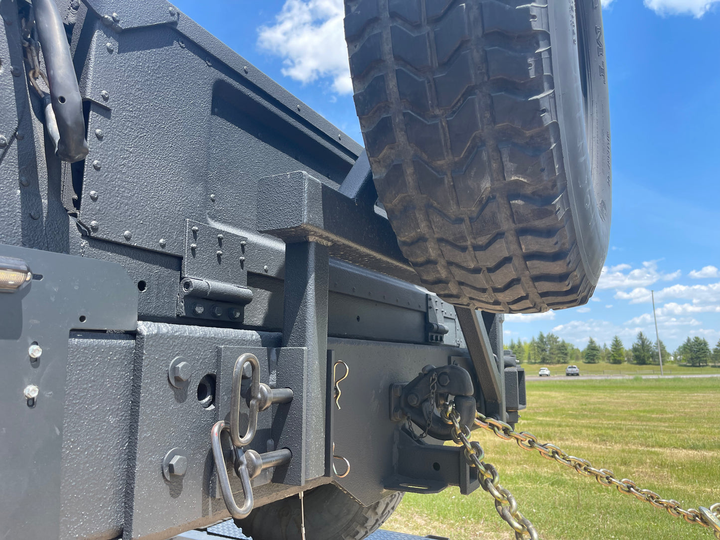 Swing away military Humvee tire carrier mounts on rear bumper – Federal ...